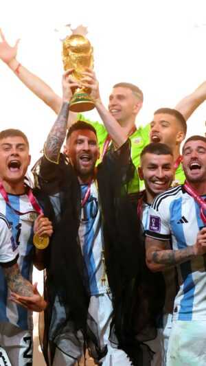 Messi Holding World Cup Wallpaper