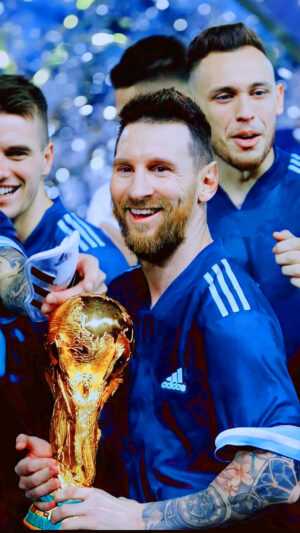 Messi Holding World Cup Wallpaper