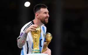 Messi Holding World Cup Wallpaper