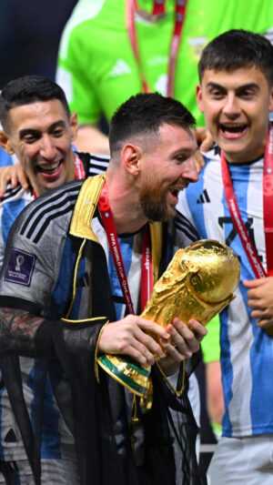 Messi Holding World Cup Wallpaper